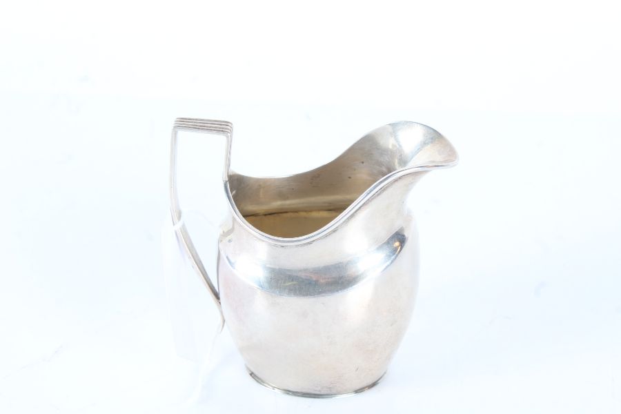 Late Victorian silver milk jug, London 1900, maker Josiah Williams & Co. With reeded angular handle,