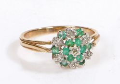 A 9 carat gold cluster ring, the head set with faux emeralds and paste, weight 2.8 grams