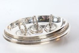 A set of three silver-plated entrée dishes, with detachable handles (3)