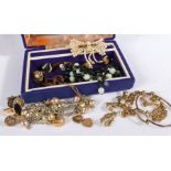 A collection of costume jewellery to include silver bangle, yellow metal jewellery to include