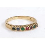 A 9 carat gold and multi-stone ring, the head set with seven stones, weight 2.4 grams