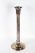 A very large and impressive silver plated candlestick, with a flared neck above a reeded stem,