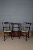 Pair of Edwardian mahogany bedroom chairs, each with needlework seats, and an Edwardian wall shelf