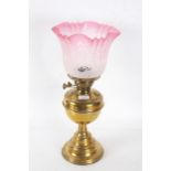 Duplex brass oil lamp, with frosted and cranberry etched glass shade