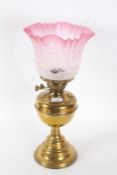 Duplex brass oil lamp, with frosted and cranberry etched glass shade