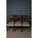 A set of six late 19th/ early 20th century oak dining chairs, with a arched cresting rail above four