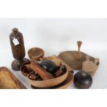 Collection of treen, to include butter pats, bowls, chopping board, table lamp base, two bowling