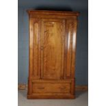 Victorian satin birch wardrobe, the moulded cornice above a single door enclosing two pull out rails
