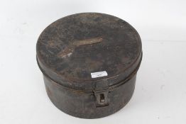 A 20th century metal hat box, with a brass plaque to the lid H. A. Jones opening to real a light