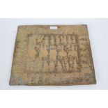 Eastern brass plaque, embossed with figures riding elephants, 35.5cm wide, 30.5cm high