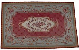 Aubusson style wool carpet, the central cream field with pink and red roses surrounded by flower