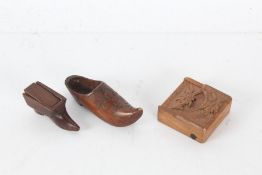 19th century treen shoe snuff box, 7cm long, together with a carved treen clog, and a carved