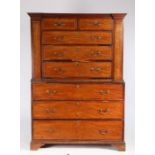 Unusual George III mahogany chest on chest, the concave cornice above two short and three long