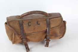 A pair of 20th century lignum vitae bowling woods housed within a leather and canvass carrying case