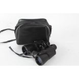 Tasco 10x50mm zip focus binculars housed within a leather bag
