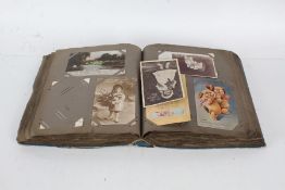Early 20th Century postcard album containing polychrome and black and white postcards, to include