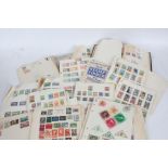 Stamps, loose album pages, housed in a box file