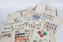 Stamps, loose album pages, housed in a box file