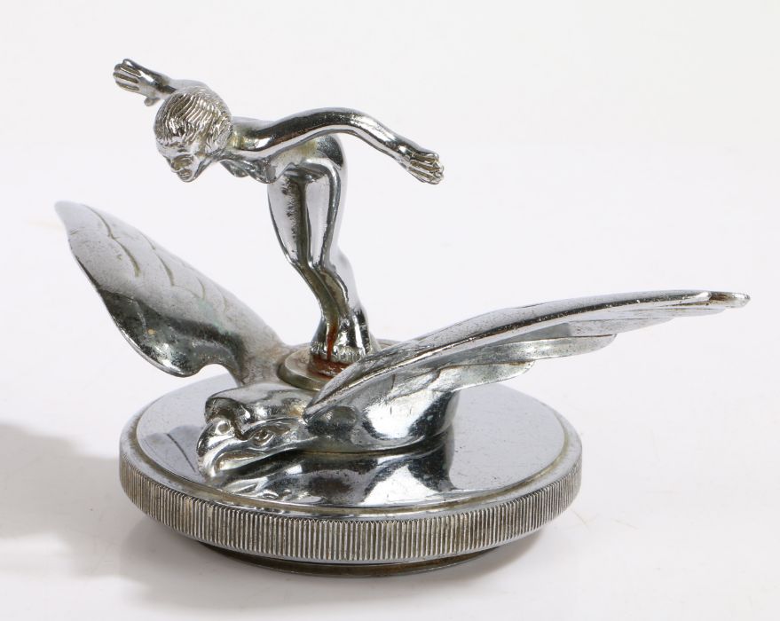 Early 20th Century bonnet ornament, depicting a nude female with her arms outspread standing on