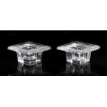 Pair of Lalique clear glass inkwells, of square form, the gadrooned rims surrounding circular