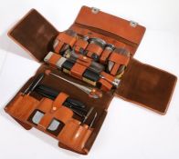 Asprey London, a gentleman's Art Deco brown leather travelling vanity case, embossed T.F.C.