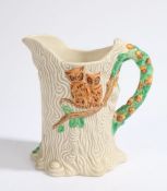 Clarice Cliff Newport Pottery jug, the moulded bark effect body with raised owl decoration and acorn