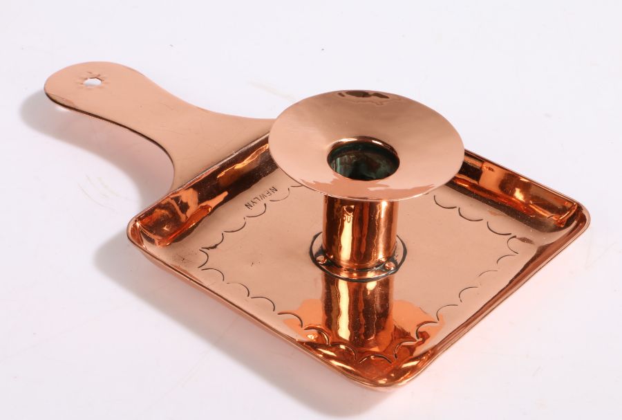 Newlyn copper chamber stick, the dished sconce above a square pan with embossed crescent