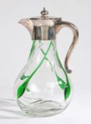 John Grinsell & Sons Ltd. silver plate mounted claret jug, the hinged lid with orb finial above a