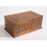 Keswick School of Industrial Arts copper box, the hinged lid with foliate and scroll embossed