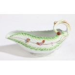 A Derby porcelain sauce boat, 18th Century, decorated with butterflies and flowers and a curled
