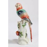 A Sampson Chelsea style porcelain parrot, the polychrome parrot standing on a branch with hanging