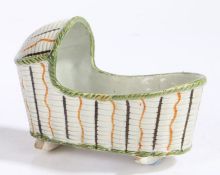 George III Prattware miniature craddle, circa 1800-10, the cream body with a green lip and orange