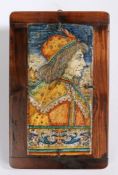 A maiolica architectural tile or panels, the rectangular tile painted with profile portrait of a