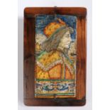 A maiolica architectural tile or panels, the rectangular tile painted with profile portrait of a