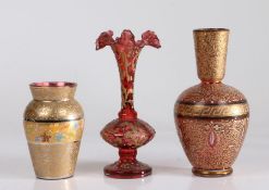 Three 19th Century bohemia glass vases, to include example with frilled neck, all with gilt scroll