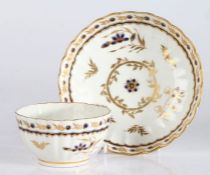 A Worcester porcelain tea bowl and saucer, late 18th Century, decorated with gilt and blue