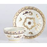 A Worcester porcelain tea bowl and saucer, late 18th Century, decorated with gilt and blue