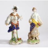 A pair of Derby porcelain figures, of a figure holding a sword and shield above a flaming torch