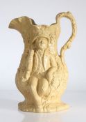 An early to mid 19th Century relief moulded jug, circa 1830-1850, depicting two men drinking beer