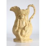 An early to mid 19th Century relief moulded jug, circa 1830-1850, depicting two men drinking beer