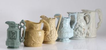 Six early to mid 19th Century relief moulded jugs, the first with a jousting competition, the second