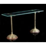 A pair of ornate late Victorian English brass shop display shelf supports, of pedestal form with