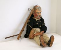 A late 19th/early 20th century handmade and painted wooden puppet in the form of an elderly