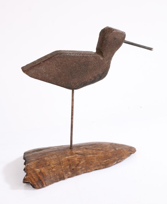 An early 20th century naive carved wooden decoy bird, carved from flat plank, elongated beak,