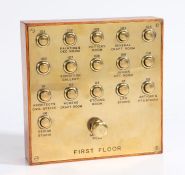 An unusual and large brass fronted School of Art sixteen button multiple bell push board, with a '