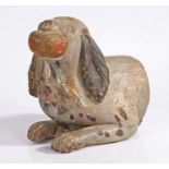 A late 19th/early 20th century Folk Art carved wooden bust of a spaniel biting a ball,