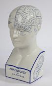 A good Chemist shop white porcelain phrenology head, by L N Fowler, of typical form in blue