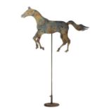 A 20th Century Folk Art painted metal horse sign, with articulated limbs, on stand, 138cm high.