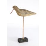 A 20th century French primitive decoy shorebird, some early paintwork, on later base, 20cm wide,