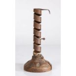 A 19th Century iron spiral and fruitwood candlestick, the spiral candle holder with internal